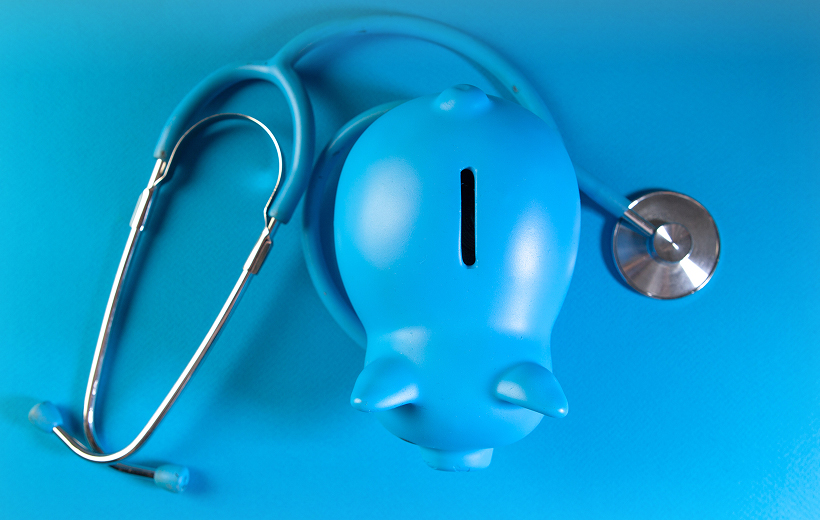 Piggy bank and stethoscope